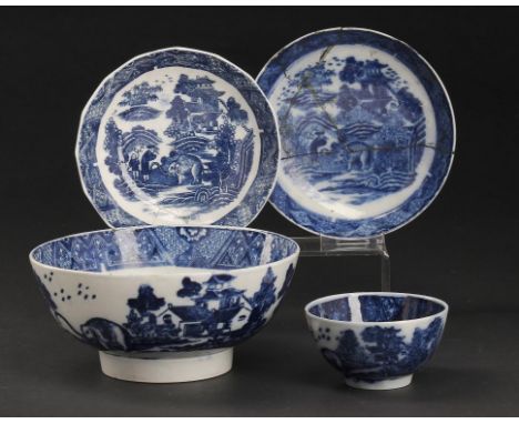 A CALCUT BLUE AND WHITE FLUTED SAUCER AND A MATCHING PEARLWARE TEA BOWL AND SAUCER AND SLOP BASIN, C1794-96 with the Elephant