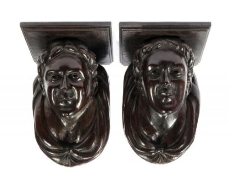 A PAIR OF CARVED OAK CORBELS, 19TH C as the head of a man a l'anticha, 33cm h ++Both in good condition, each with approx 1cm 