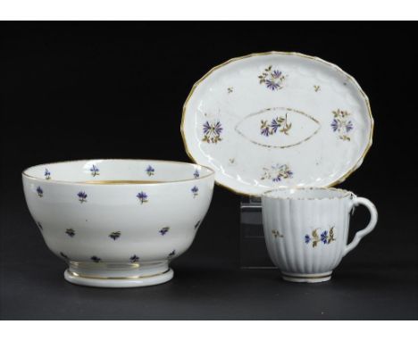 A CAUGHLEY POLYCHROME SLOP BASIN AND A SIMILAR CAUGHLEY COFFEE CUP AND SHANKED OVAL TEAPOT STAND, C1795 enamelled with the Sp