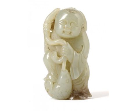 A CHINESE JADE PEBBLE CARVING OF A SMILING BOY WITH A HOOKED FISH, 19TH/20TH C 6cm h ++In good condition