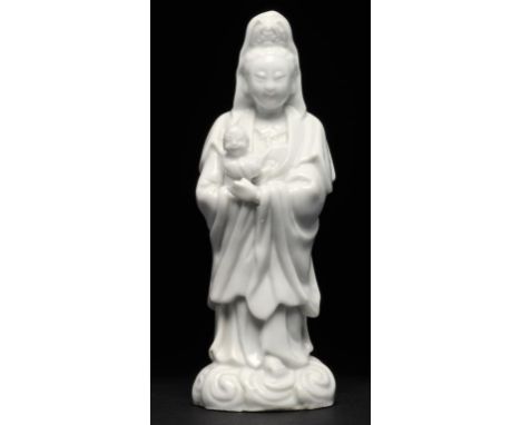 A CHINESE BLANC DE CHINE FIGURE OF GUANYIN, KANGXI 15.5cm h, dealer's label Provenance: S Marchant & Son, London. ++Left hand