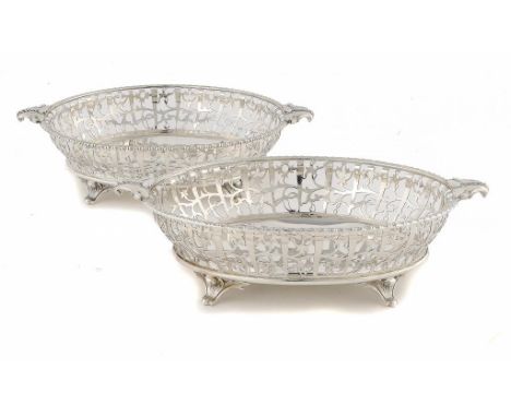 A PAIR OF EDWARD VIII SILVER OPENWORK OVAL FRUIT BASKETS with acanthus handles and feet, 31cm w, by Harrison Bros & Howson, S