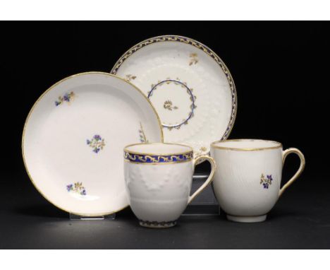 TWO DERBY MOULDED COFFEE CUPS AND SAUCERS, C1785-87 AND C1770 saucers 12.5 and 13cm diam, puce painted mark ++One saucer with