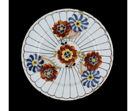 AN ENGLISH DELFTWARE 'IMARI' PLATE, C1760 23cm diam ++Flat chip on rim and some typical small spots of flaking around the rim