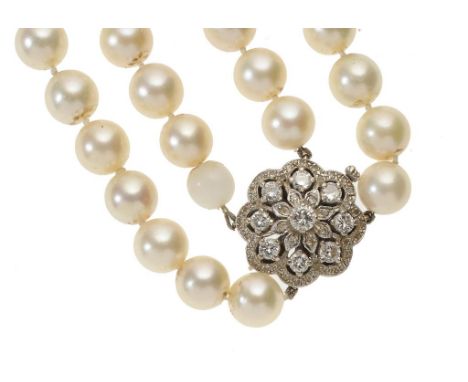 A CULTURED PEARL TWO STRAND NECKLACE of approx 9mm cultured pearls with white gold and diamond clasp, pearls approx 9mm diam,