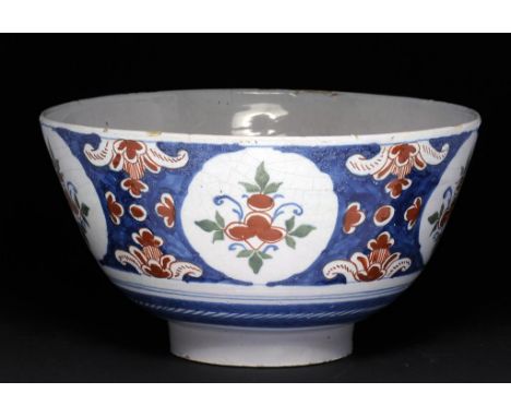 AN ENGLISH DELFTWARE BOWL, BRISTOL, C1750 painted in the blue, red, green palette, the interior with a blue tree and clusters