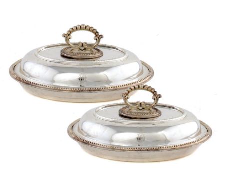 A PAIR OF VICTORIAN SILVER OVAL ENTRÉE DISHES AND COVERS with detachable handle, crested, 30cm w, by Fenton Bros, Sheffield 1