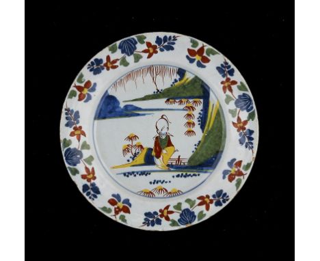 AN ENGLISH DELFTWARE CHINOISERIE PLATE, LAMBETH HIGH STEET, C1765-75 23cm diam ++An excellent example in very fine condition 