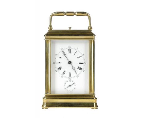 A FRENCH BRASS CARRIAGE CLOCK, C1900 with alarm and striking on a gong, in gorge case with repeat button in the top, 13.5cm h