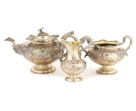 A SCOTTISH VICTORIAN SILVER TEA SERVICE crisply chased with flowers and foliage, teapot 17cm h, by Leonard Urquhart, Edinburg