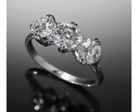 A DIAMOND THREE STONE RING, EARLY MID 20TH C in platinum, size O ++In good second hand condition