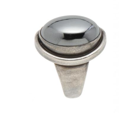 A GEORG JENSEN SILVER AND HAEMATITE RING DESIGNED BY HARALD NIELSEN 46A maker's mark, import marked, London 1966 ++In very go