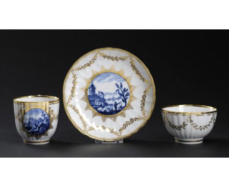 A RARE REEDED COALPORT TRIO, 1800-14 painted with Bright Landscape pattern and gilt, saucer 14cm diam Provenance: Godden of W