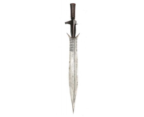 TRIBAL ART. AN AFRICAN DAGGER, GABON, LATE 19TH/EARLY 20TH C with decorated spatulate blade, the carved wood hilt of deep col