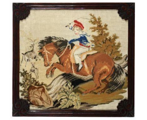 A PAIR OF VICTORIAN BERLIN WOOLWORK PICTURES, C1840 of a girl on a pony or a boy playing with a parrot, carved rosewood frame