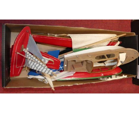A small collection of small scale plastic and wooden kit built pond yachts and others