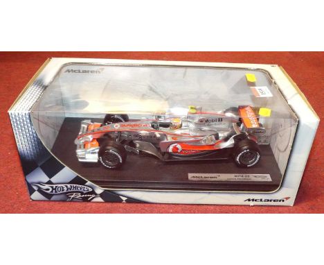 A Hot Wheels Racing 1/18 scale boxed model of a Maclaren MP4/22 Lewis Hamilton