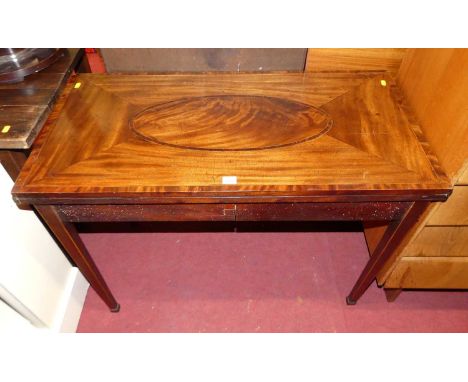 An early 19th century mahogany, flame mahogany, and further crossbanded fold-over card table, having rear gateleg action, rai