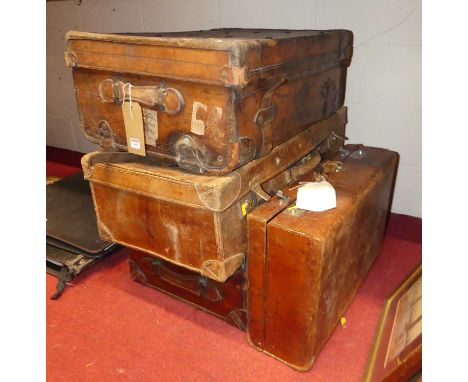 Assorted luggage, to include Edwardian leather travel trunk, w.70cm; and three leather suitcases (4)
