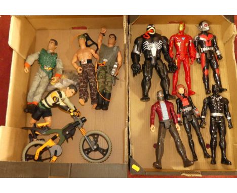 Two trays containing Marvel related figures together with a small quantity of Action Man figures and related accessories