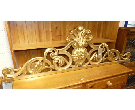 A 19th century Italian carved gilt wood pelmet cresting, all over floral scroll decorated, 47.5 x 155cm