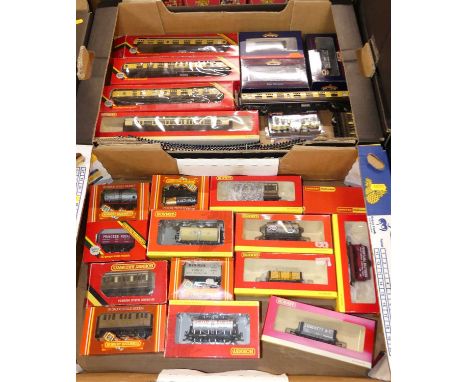 Two trays containing mostly Hornby Railway boxed 00 gauge rolling stock and coaches together with a Bachmann branchline rolli