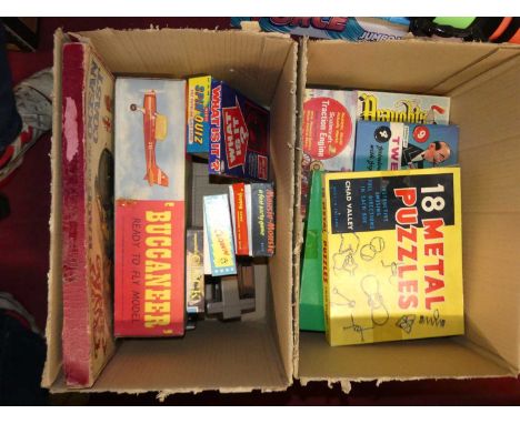 Two boxes of various board/interactive games and others to include Merit Spin Quiz, Joey the Clown, Chad Valley 18 metal puzz