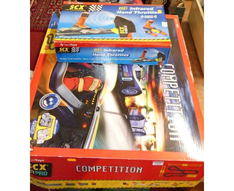 A Tecnitoys 1/32 scale SCX Pro Competition electronic boxed set (appears complete) together with SCX remote control, hand thr