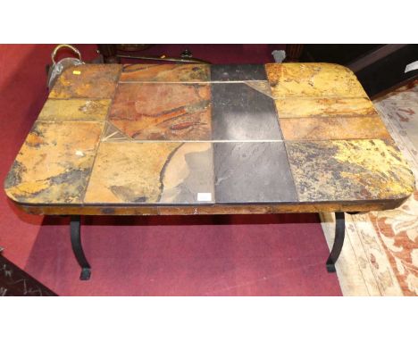 A wrought iron and tile top round cornered rectangular coffee table, raised on X-framed end supports, length 100cm