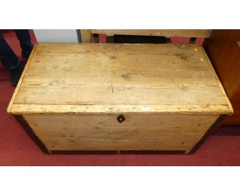 A rustic boarded pine and metal bound hinge topped tool chest, having iron end carry handles, w.112cm 