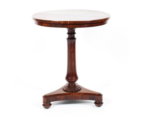 A Victorian mahogany circular occasional/wine table raised on a turned column to a flower rose raised on a tripod base to cas