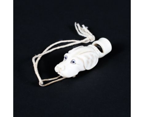 An early 20th century carved ivory whistle in the form of a dog's head, L5.5cm Condition Report: Crack to underside of mouthp