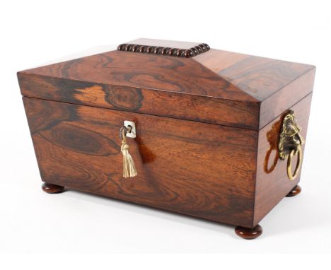 A 19th Century rosewood sarcophagus shaped tea caddy with lion ring handles. complete with two canisters, 32cm x 17cm x 20cm