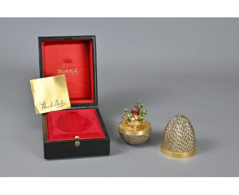 STUART DEVLIN, LONDON 1976, ROBIN SURPRISE EGG. Sterling silver gilt with robin in a tree with nest of chicks. marked to base