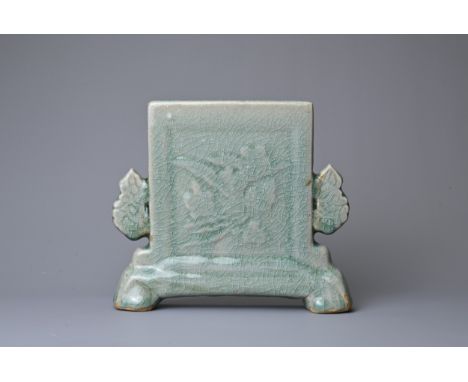 A SMALL CHINESE CELADON GLAZED PORCELAIN TABLE SCREEN, 18/19TH CENTURY. Thickly potted of square form supported on two feet w