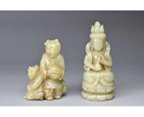 A CHINESE CARVED JADE FIGURE OF A GUANYIN AND A FIGURE GROUP. The Guanyin seated on a lotus flower holding a gourd-shaped ves