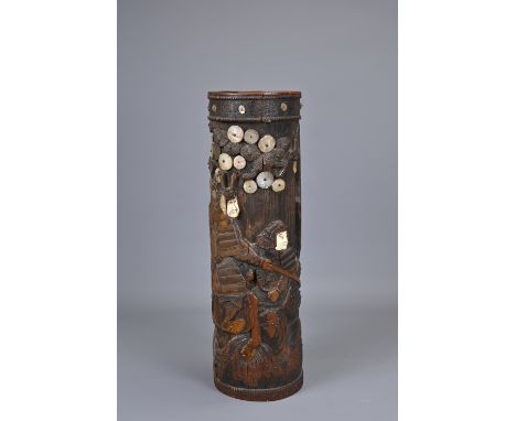 AN EARLY 20TH CENTURY JAPANESE CARVED AND INLAID BAMBOO BRUSH POT. Carved with samurai on horseback, with bone inlaid faces a