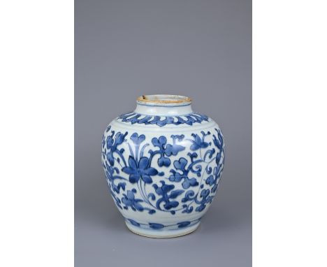 A CHINESE BLUE AND WHITE PORCELAIN JAR, LATE MING DYNASTY. Continuous floral scroll decoration below a band of lotus lappets.