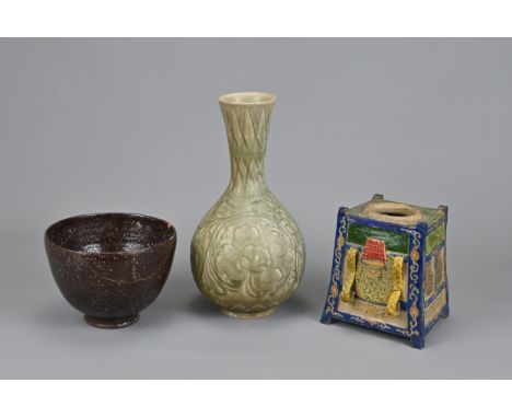 THREE CHINESE / JAPANESE CERAMIC ITEMS. To include a Chinese Yaozhou style celadon glazed pear shaped bottle vase with flared