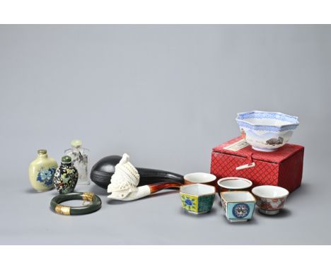 A COLLECTION OF ASIAN PORCELAIN, SNUFF BOTTLES, A JADE BANGLE AND OTHER ITEMS. Comprising: five porcelain sake cups, a contem