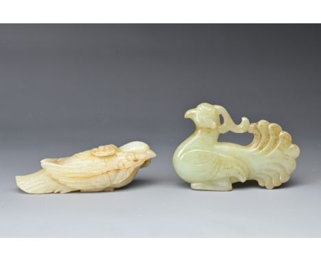 TWO CHINESE CARVED JADE BIRDS.  Pale in colour, the first carrying ruyi-shaped leaves in its beak, the second with elaborate 
