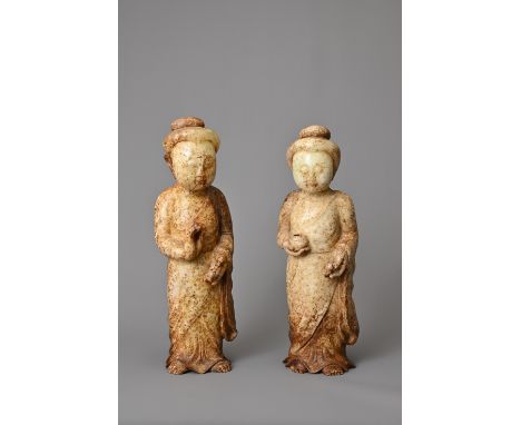 A PAIR OF CHINESE JADE FIGURES. The figures standing dressed in robes holding a bowl. Approx. 22cm tall. (2)Both in good over