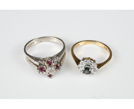 A 9CT WHITE GOLD DIAMOND AND RUBY MOUNTED RING AND A 9CT WHITE GOLD DIAMOND AND BLUE STONE MOUNTED RING. Each hallmarked, the