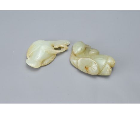 TWO CHINESE CARVED JADE ITEMS. Comprising; a pale jade bird and a figure of a boy carrying a flower, 5.5cm long (2)The boy wi