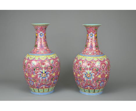 A PAIR OF CHINESE RUBY GROUND PORCELAIN VASES, DAOGUANG MARK. Decorated in famille rose enamels with leafy chrysanthemum scro