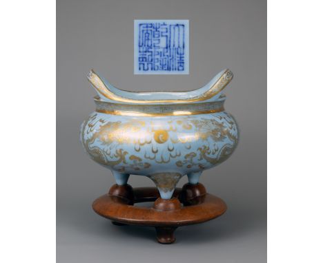 A CHINESE SKY BLUE GROUND AND GILT PORCELAIN TRIPOD CENSER, QIANLONG MARK, 18/19TH CENTURY.Heavily potted on three coned feet