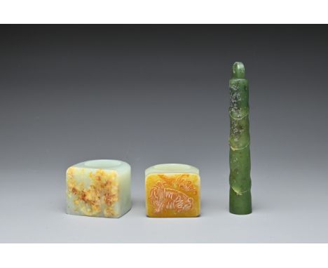TWO CHINESE CARVED JADE RINGS AND A SPINACH JADE PENDANT. Comprising: two pale jade rings, one carved with a figure of an imm