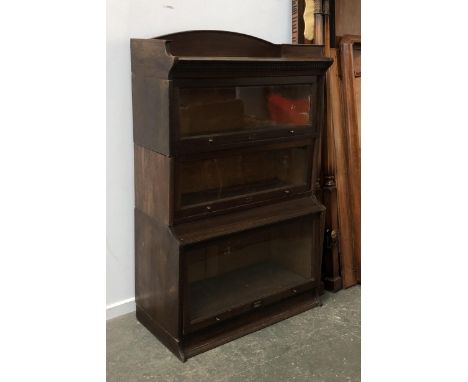 'The Lebus Bookcase', an early 20th century Globe Wernicke style three part oak sectional bookcase, 88cmW 