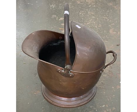 A copper helmet form coal scuttle 