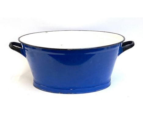 A very large blue enamel twin handled wash basin, 85cmW 